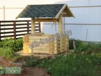 Колодец рубленый вокруг кольца