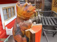 Деревянная скульптура "Медведь с гармошкой"